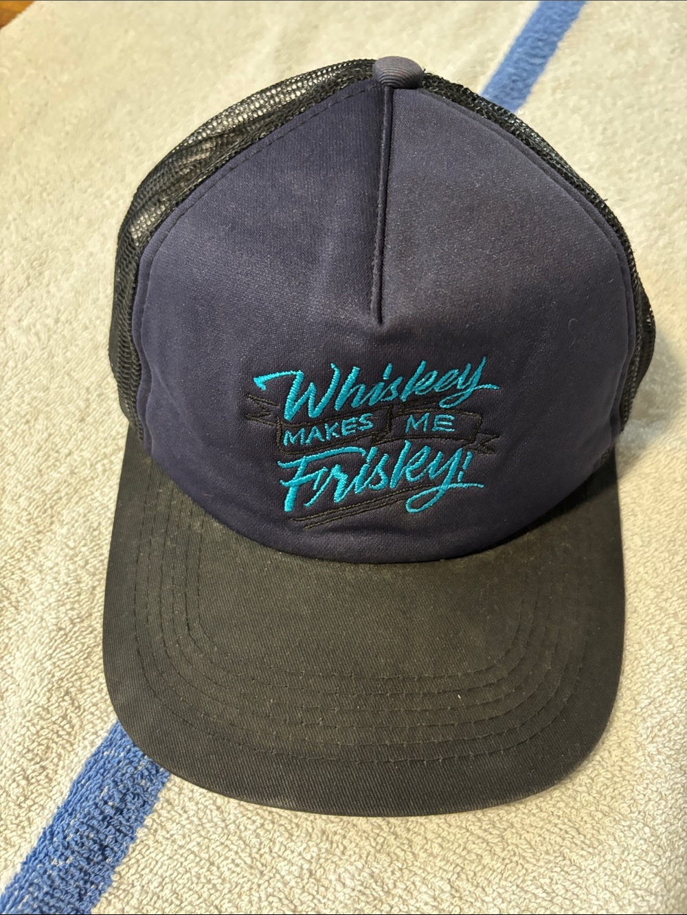 Embroidered 'Whiskey Makes Me Frisky' Navy Trucker Hat